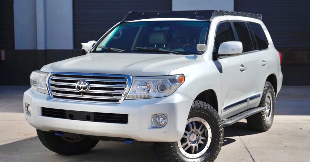 Front view white Toyota Land Cruiser sleek grille
